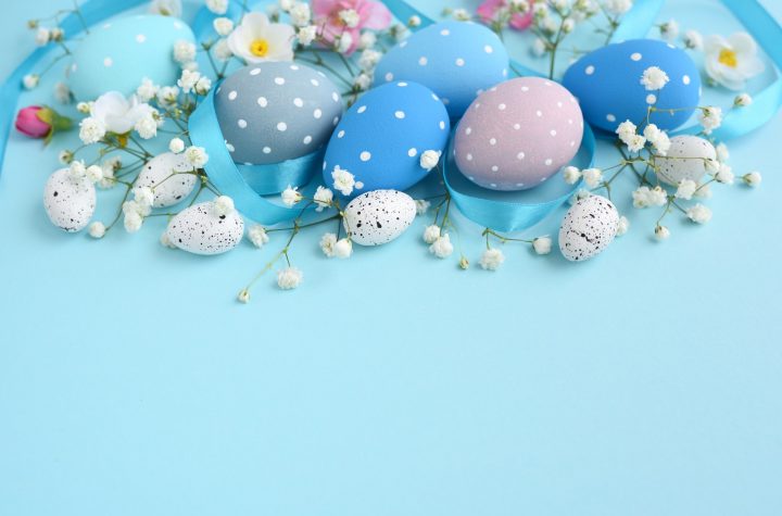 Easter eggs on a blue background. Festive easter background