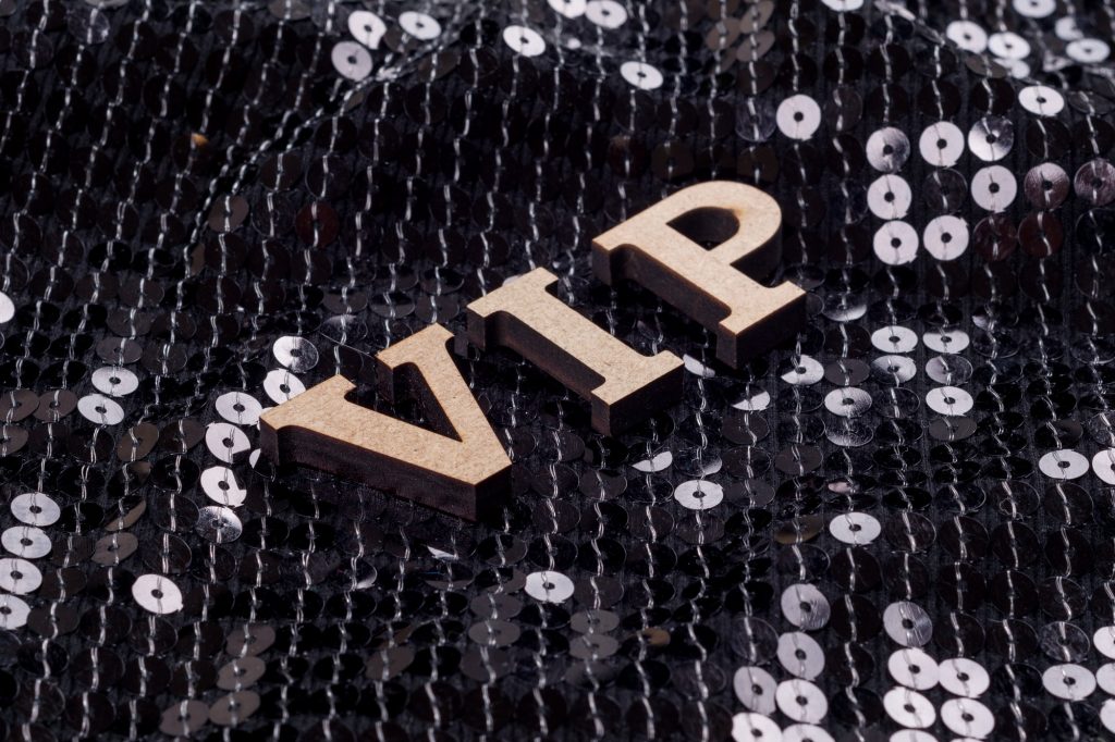 VIP is written in abstract letters. Black luxurious sparkling background