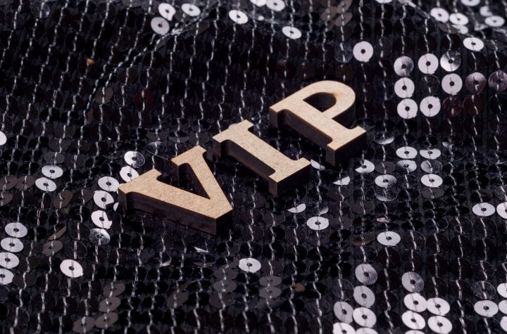 VIP is written in abstract letters. Black luxurious sparkling background