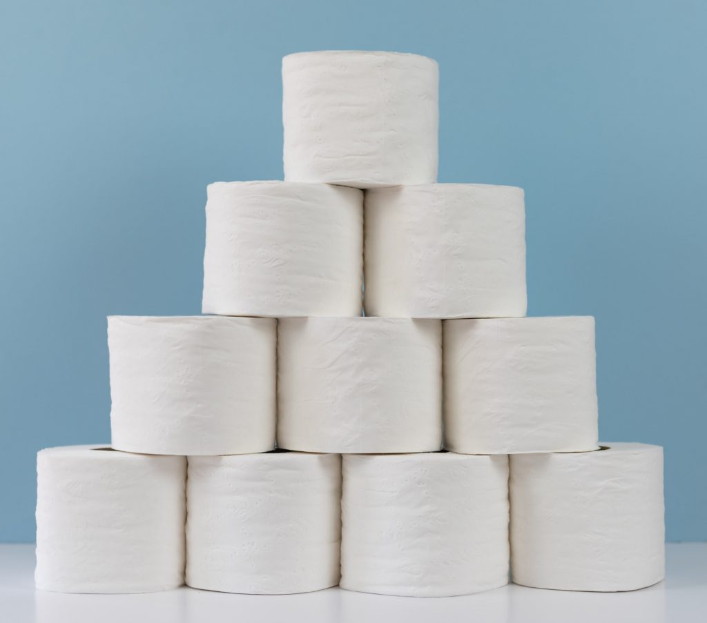 Stack of rolls of toilet paper on a blue background