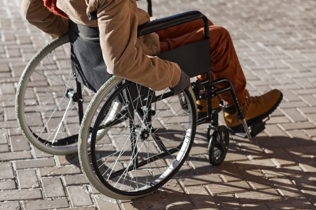 Wheelchair User Outdoors in City