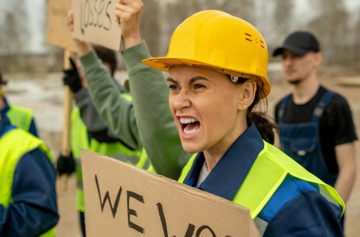 Very angry female builder screaming on strike