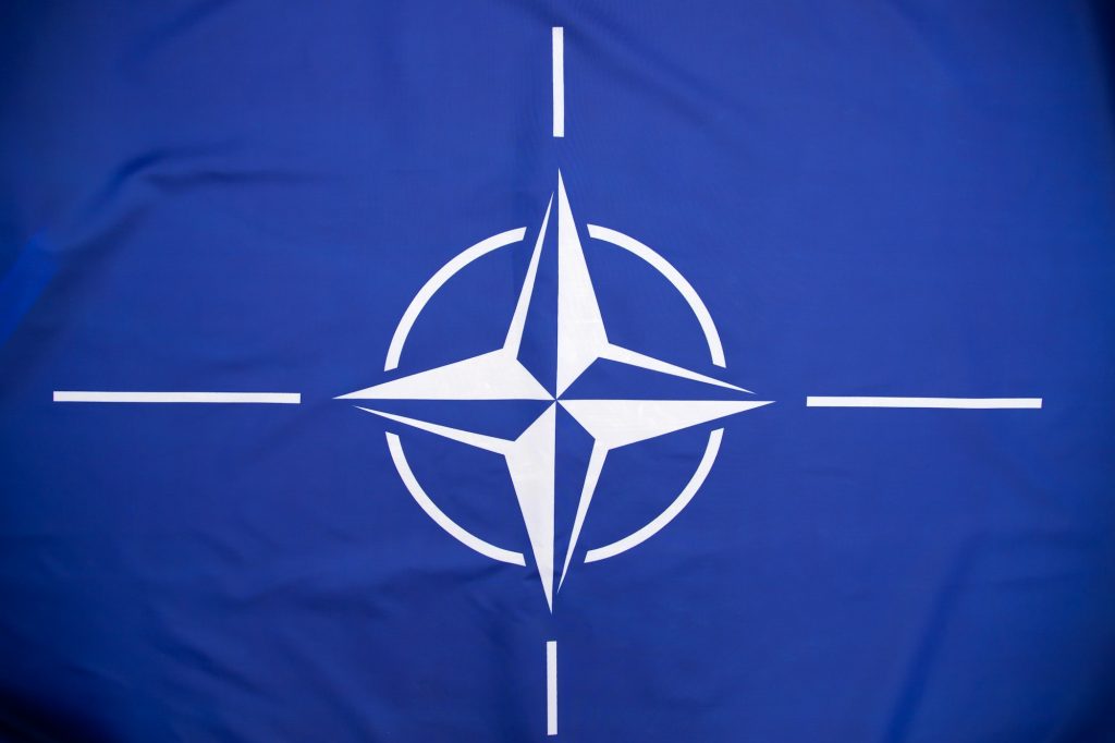 NATO flag.North Atlantic Treaty Organization flag waving.
