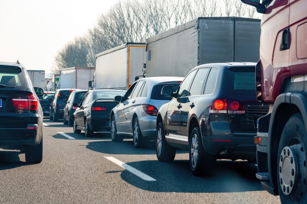 Traffic jam on highway with cars and trucks stuck in congestion
