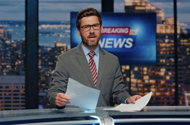 Man newsreader reporting reportage at newscast modern