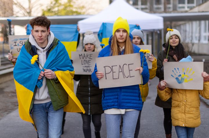 Protest against Russian invasion of Ukraine. People holding anti war sings and banners in the street.