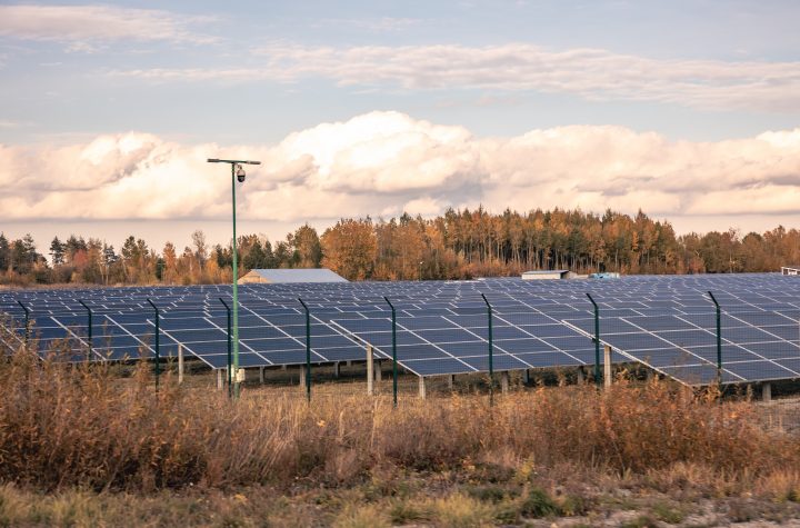 Solar power station in the autumn nature in a rural area.