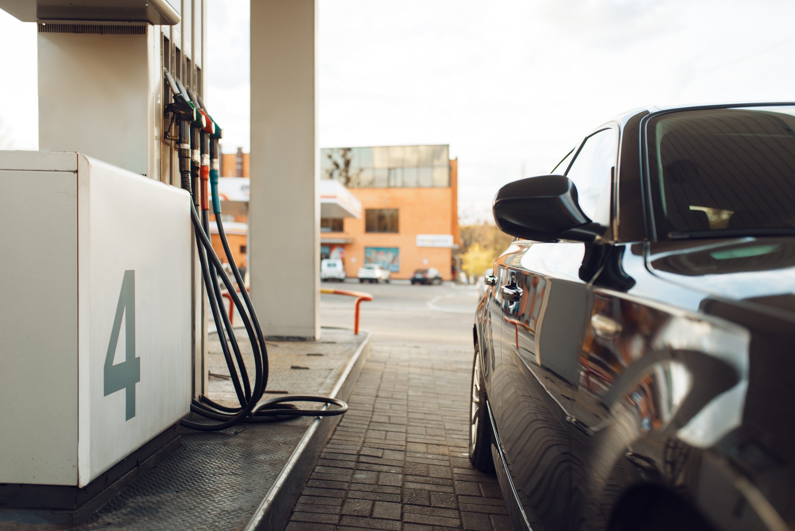Car fueling on gas station, fuel refill, nobody. Petrol, gasoline or diesel refuel service, petroleum refueling, Tankstelle