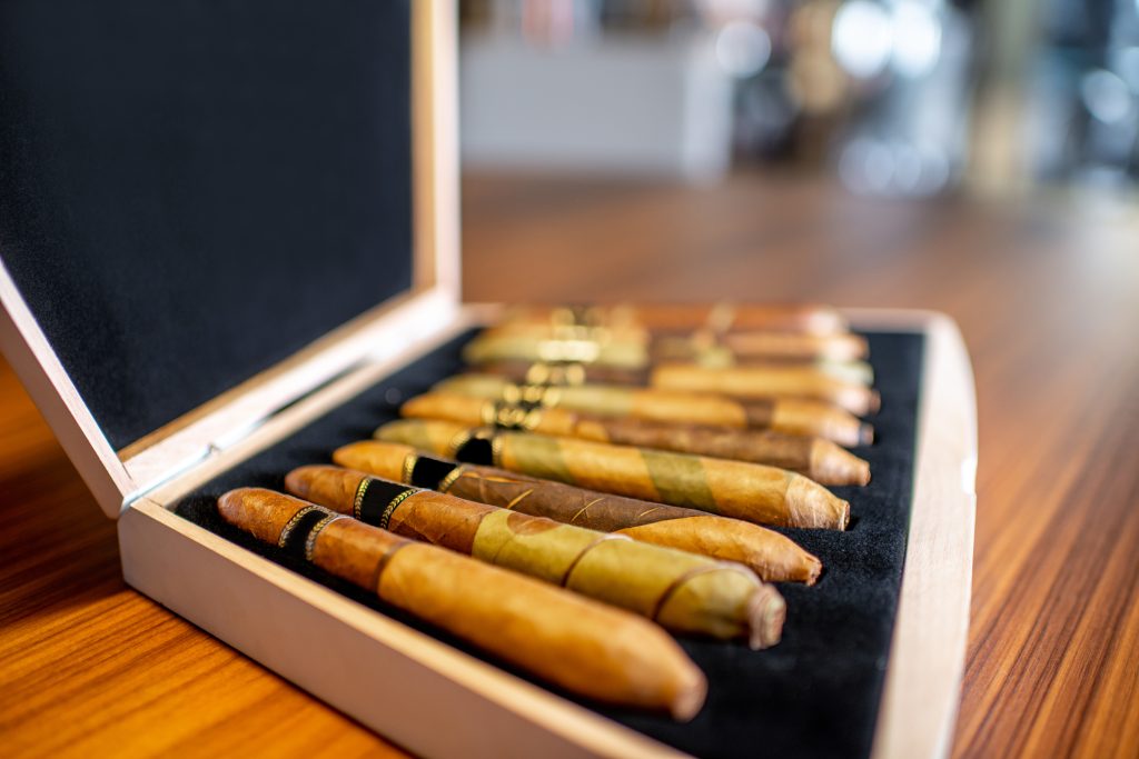 Close-up of luxury cigar set on the wooden table indoors, Zigarren