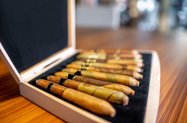 Close-up of luxury cigar set on the wooden table indoors, Zigarren